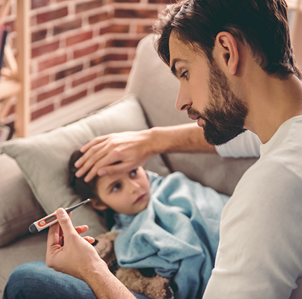 father taking daughter's temperature